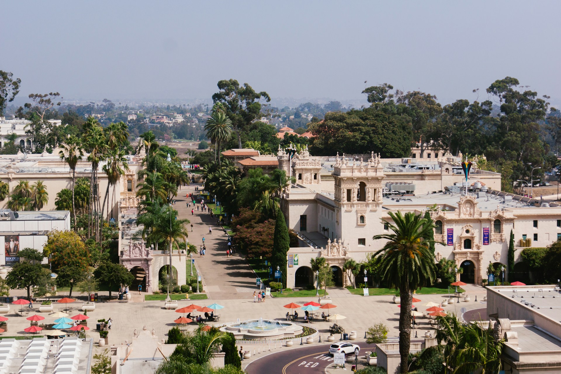 Aerial view of Balboa Park’s Spanish-style architecture and gardens.