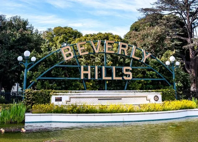 Beverly Gardens Park with manicured gardens and city sign.