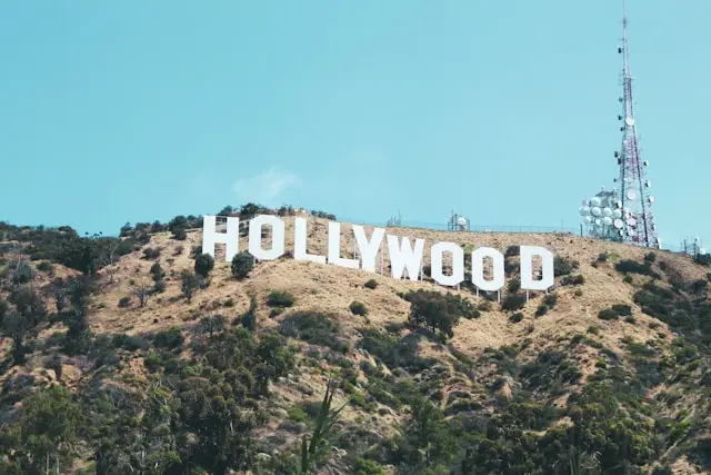 Hollywood Sign in Los Angeles against clear blue sky.