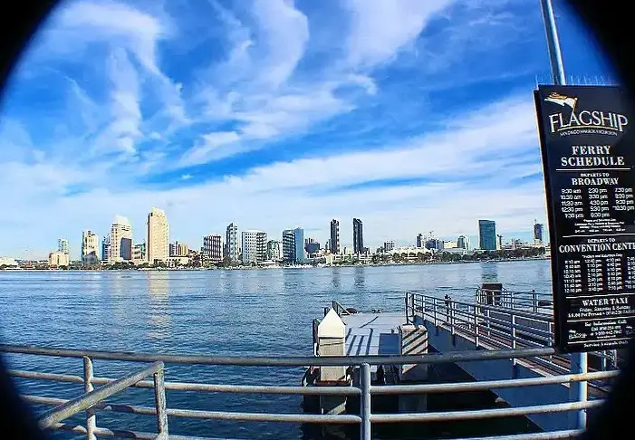 Coronado Ferry Landing with waterfront shops and San Diego skyline views.