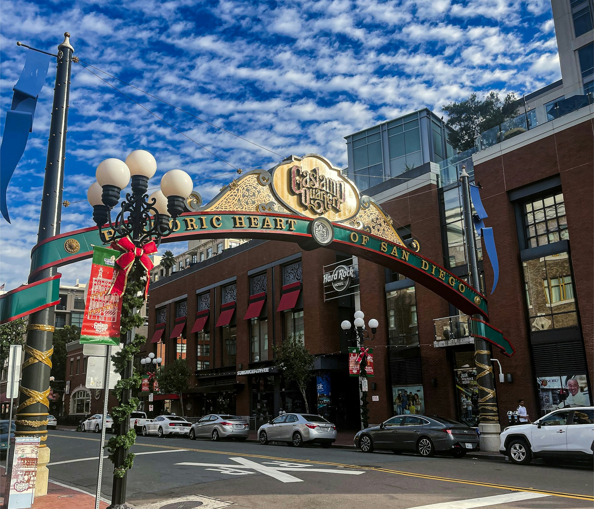 Evening scene in the Gaslamp Quarter with historic buildings and lights.